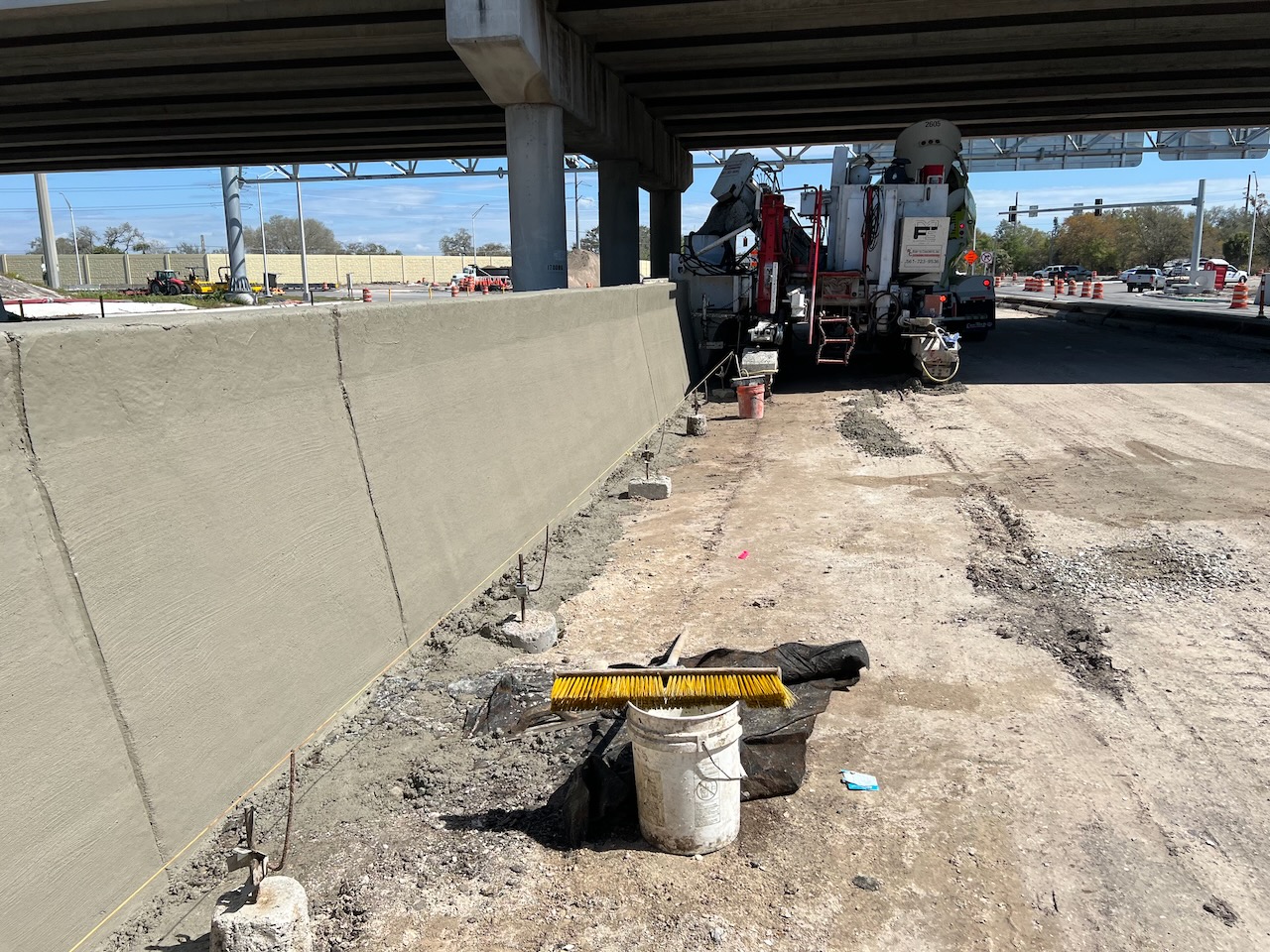 Concrete barrier construction beneath an overpass