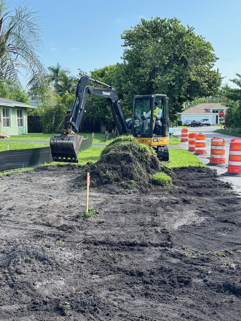Excavator preparing a residential worksite