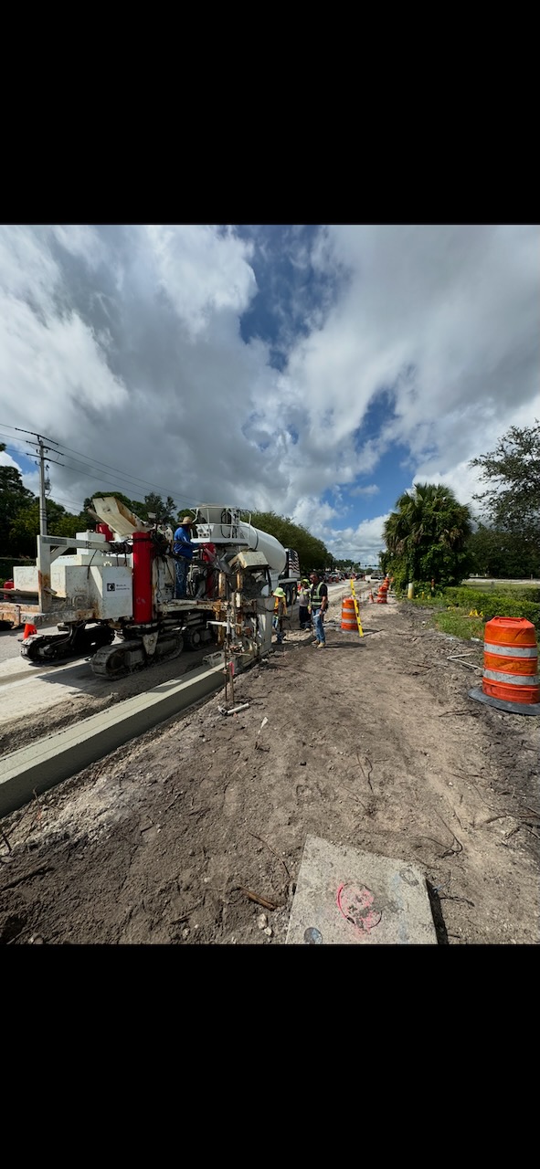 Concrete paving equipment working on a roadway