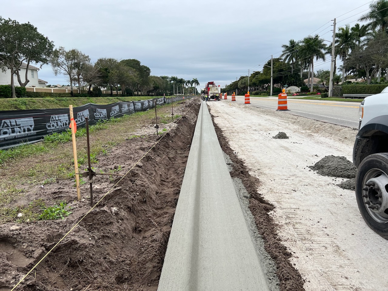 New concrete curb installed along a roadway