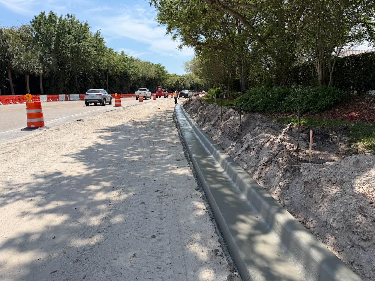 Fresh concrete curb along an active roadway