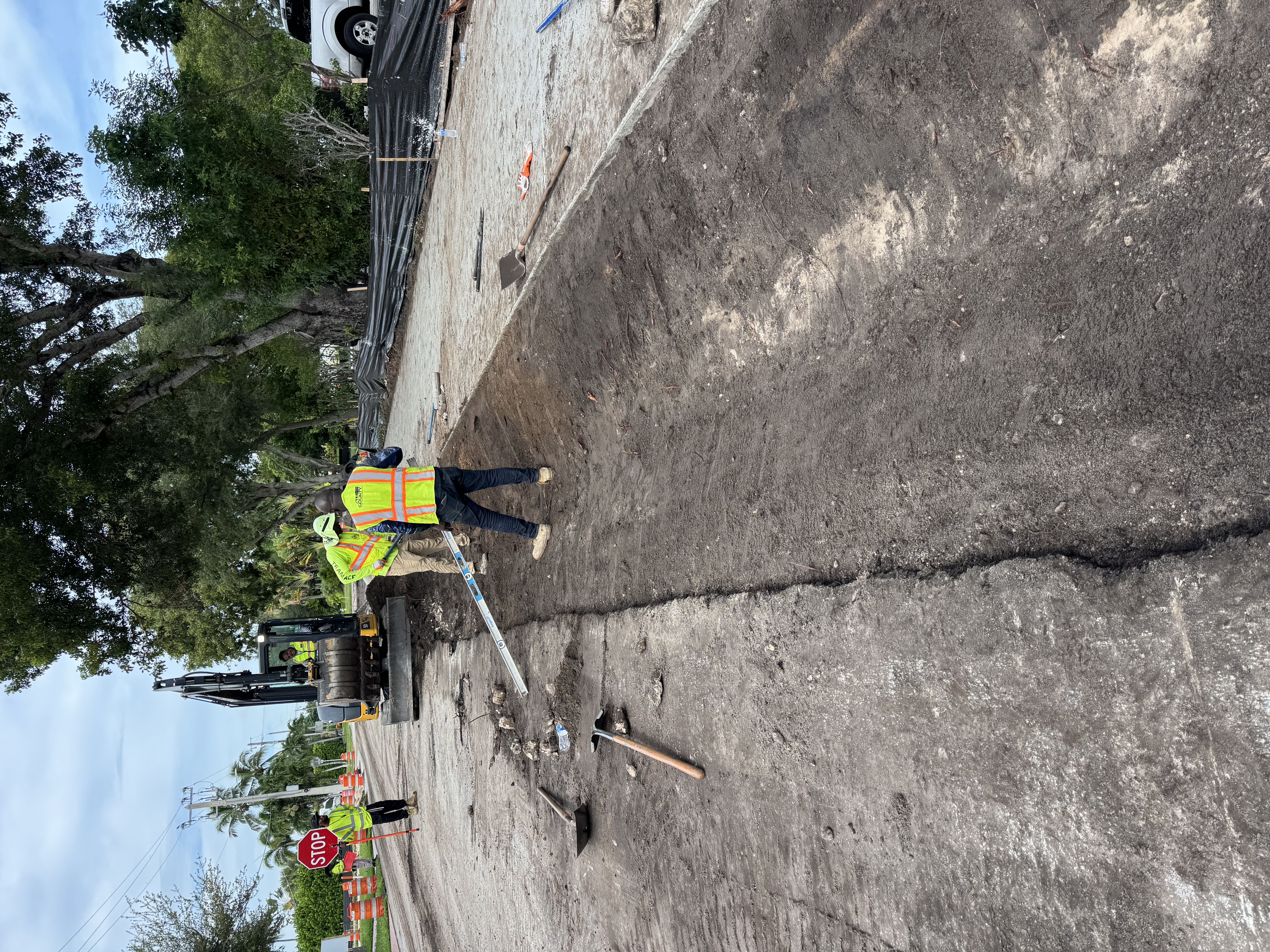 Excavator preparing a route for concrete work