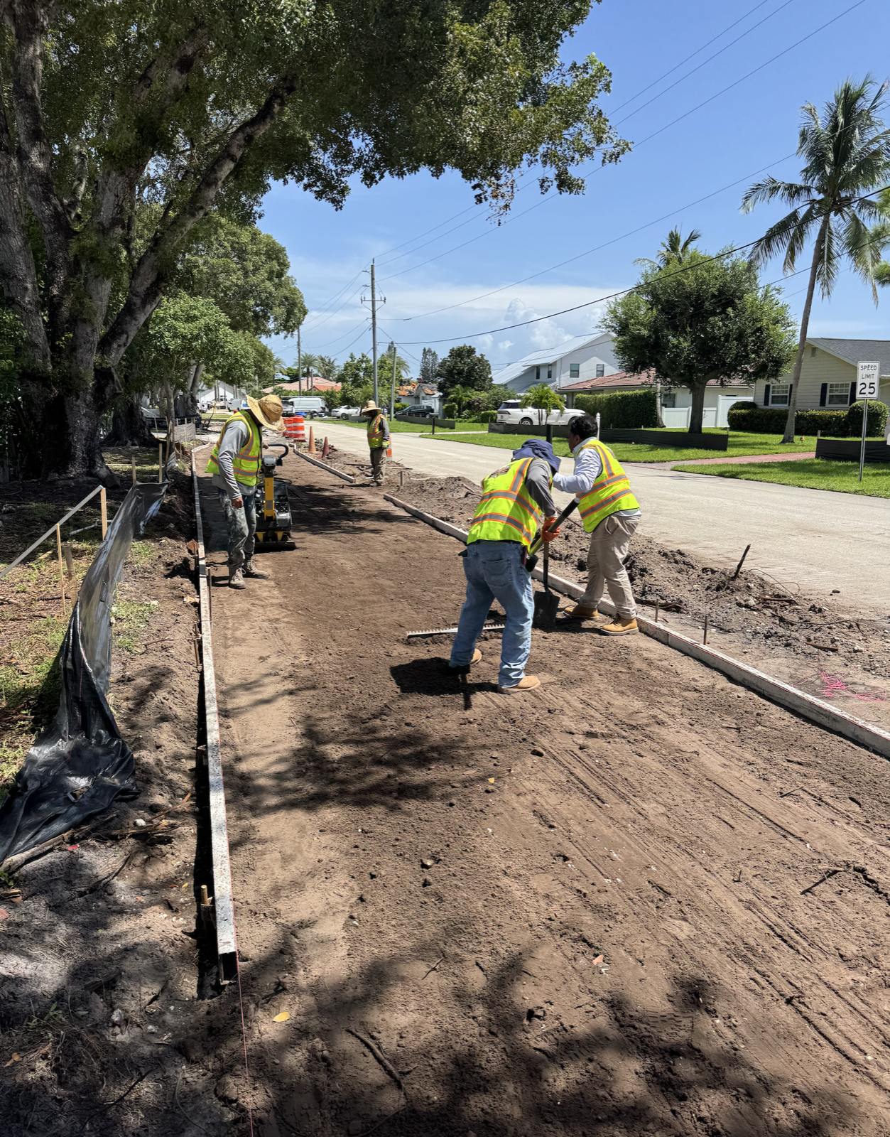 A.R.C. crew preparing a sidewalk and roadway access route